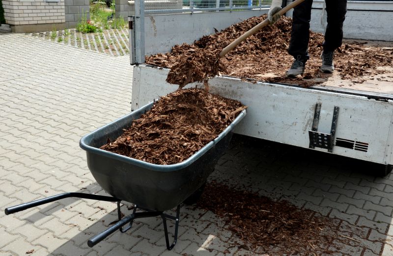 Mulch spreading in a landscaped yard